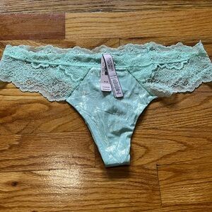Brand new never worn with tag Victoria secret mint shimmer w/ lace thong size M
